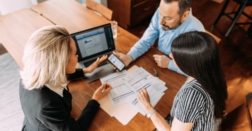 Three people having a financial planning retirement meeting