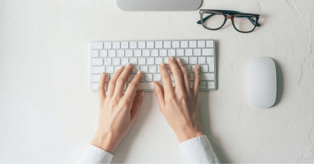 Person typing on wireless keyboard