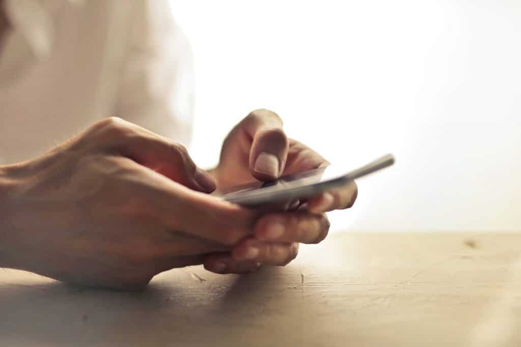 Person holding smart phone
