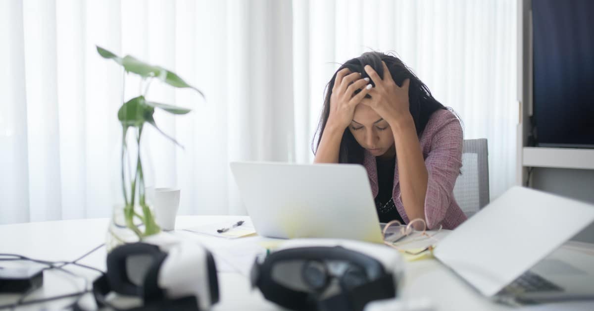 Frustrated person sitting at their desk