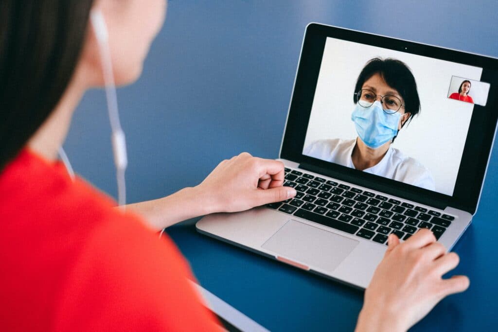 Person on telemedicine visit with computer