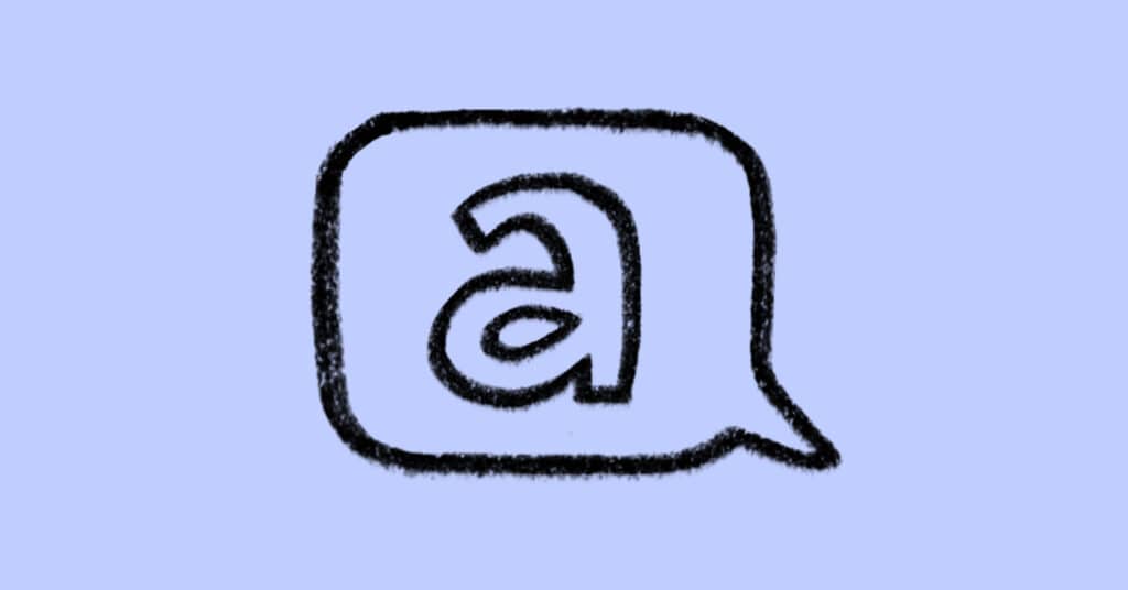 A rough, black outline of a speech bubble containing a lowercase letter a, drawn in a sketchy style on a light purple background.